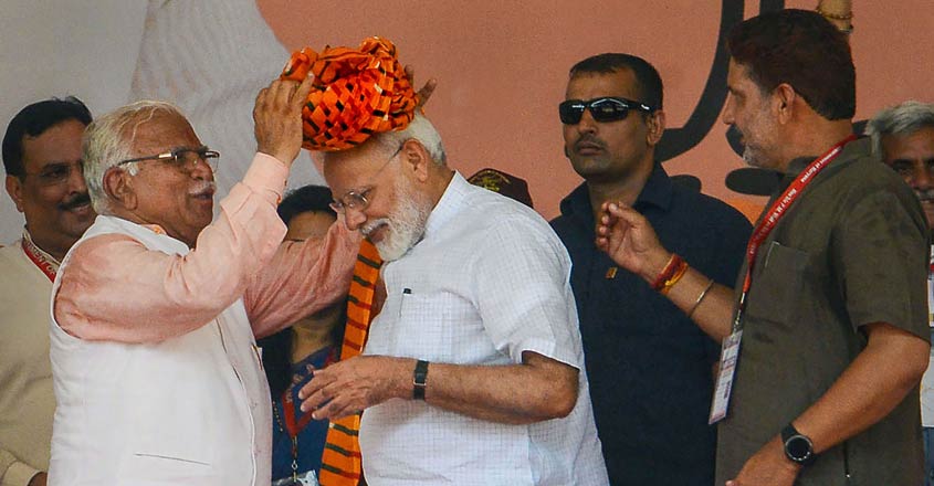 Modi presents govt's 100-day report in poll-bound Haryana Modi presents govt's 100-day report in poll-bound Haryana