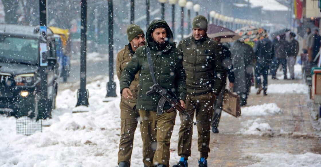 Police personnel patrol during heavy snowfall, in Srinagar, Wednesday, Jan. 15, 2020. Snowfall continued in the Kashmir Valley for the fourth consecutive day, leading to cancellation of all flights (PTI Photo)