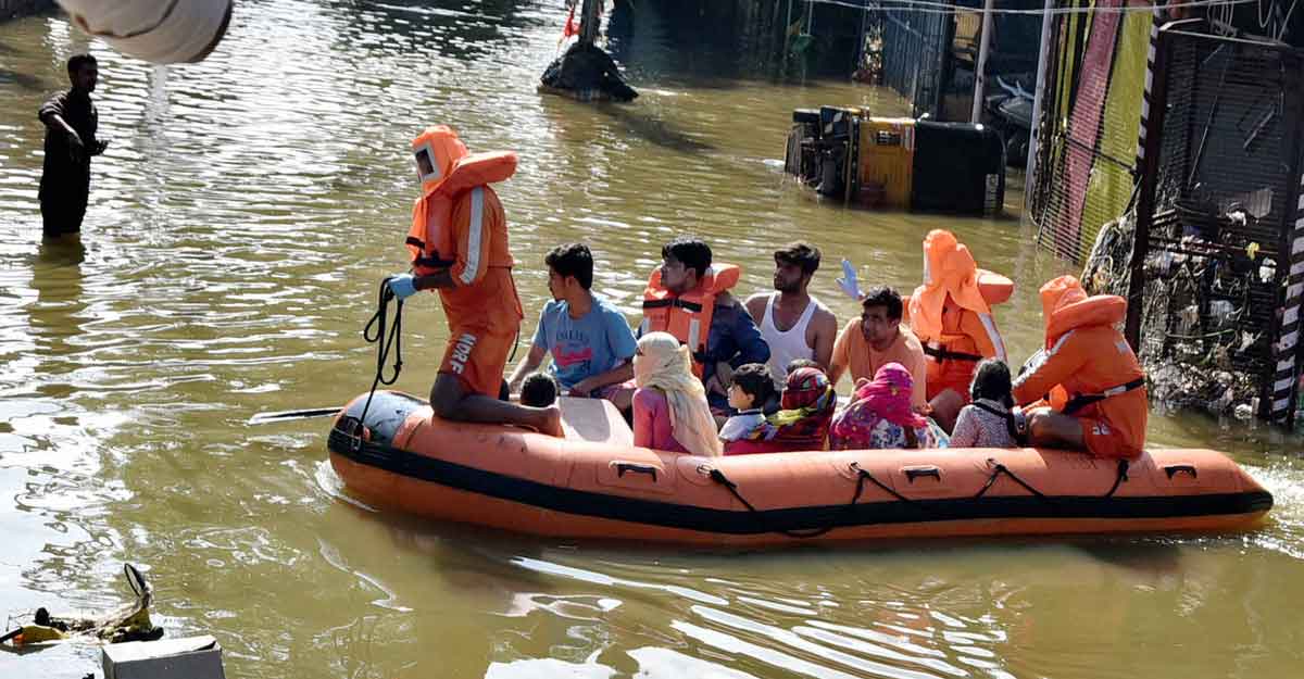 Residents are evacuated from a flooded neighbourhood after heavy rainfall in Hyderabad Residents are evacuated from a flooded neighbourhood after heavy rainfall in Hyderabad