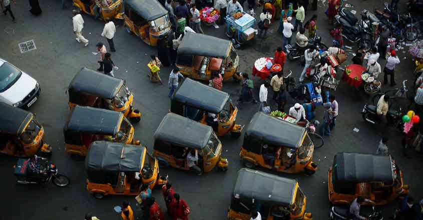 INDIA Auto rickshaws sit in a traffic jam in the old city in central Hyderabad. Photo: Reuters
