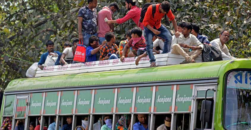 Kolkata: An overcrowded bus with migrant workers returning back home amid COVID-19 outbreak, seen during complete lockdown in the country in a bid to curtail the spread of coronavirus, in Kolkata on March 23, 2020. (Photo: Kuntal Chakrabarty/IANS) Kolkata: An overcrowded bus with migrant workers returning back home amid COVID-19 outbreak, seen during complete lockdown in the country in a bid to curtail the spread of coronavirus, in Kolkata on March 23, 2020. (Photo: Kuntal Chakrabarty/IANS)