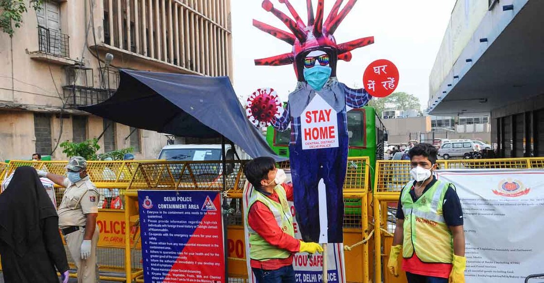 Volunteers create awareness about staying home during the nationwide lockdown imposed to curb the coronavirus pandemic in New Delhi. Photo: PTI