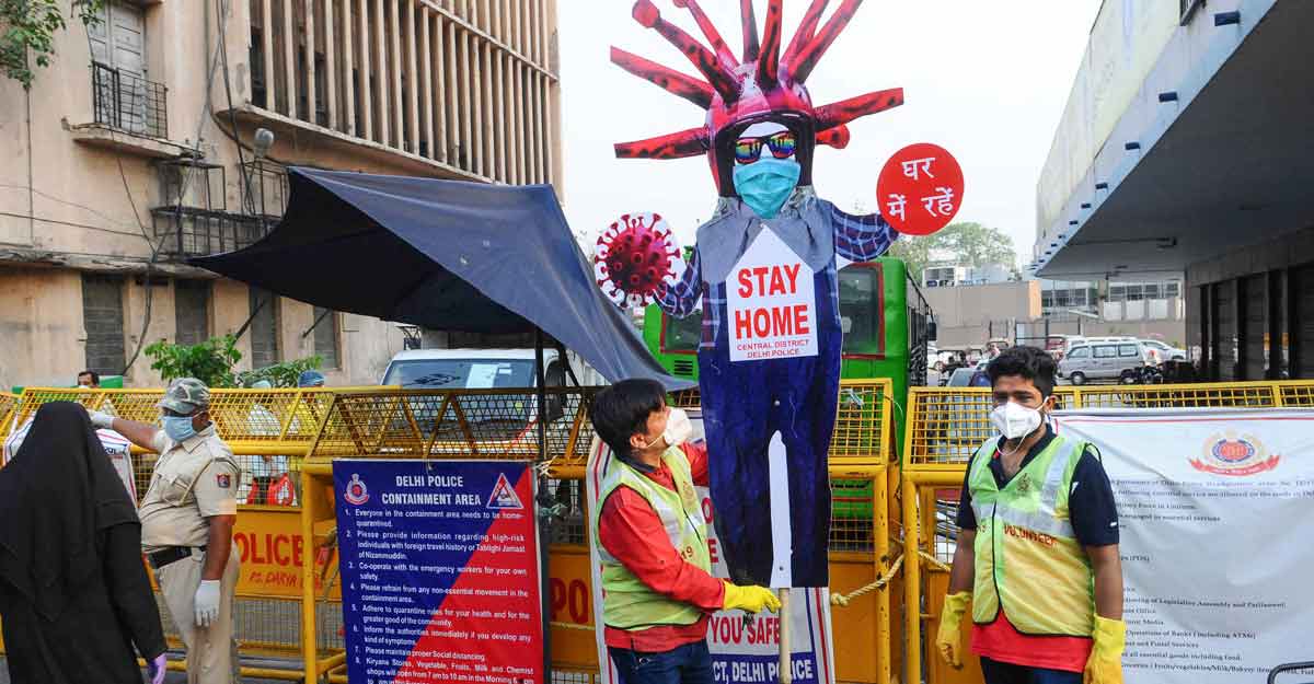 Volunteers create awareness about staying home during the nationwide lockdown imposed to curb the coronavirus pandemic in New Delhi. Photo: PTI