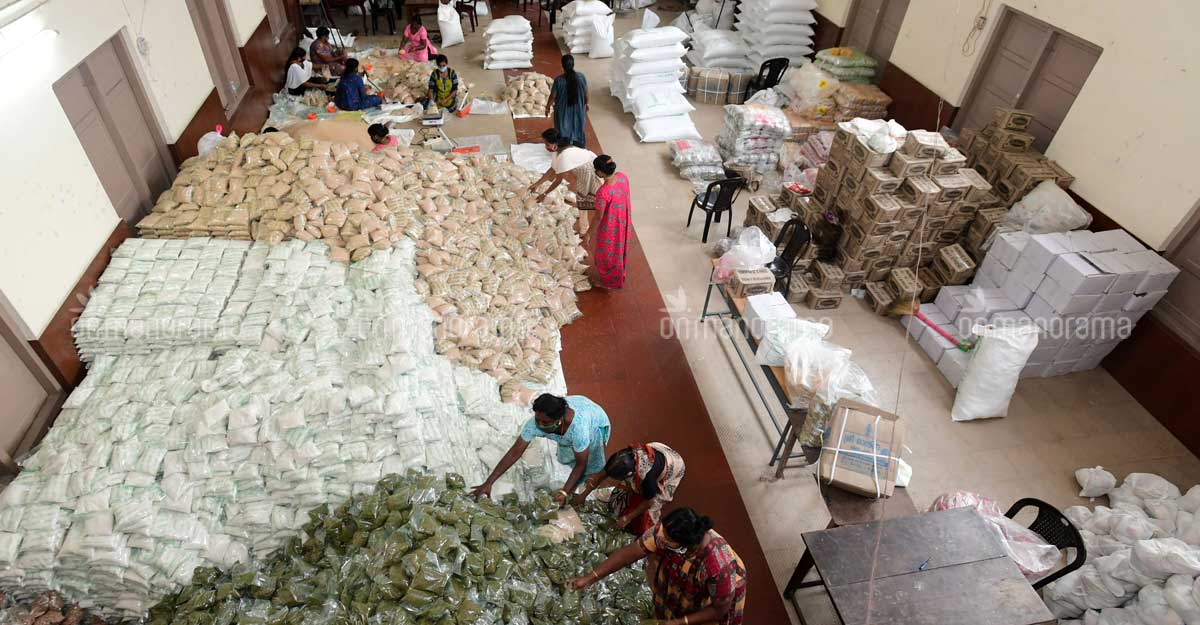 Workers prepare Kerala Government's Onam food kits in Kerala's Kottayam. File Photo: Harilal