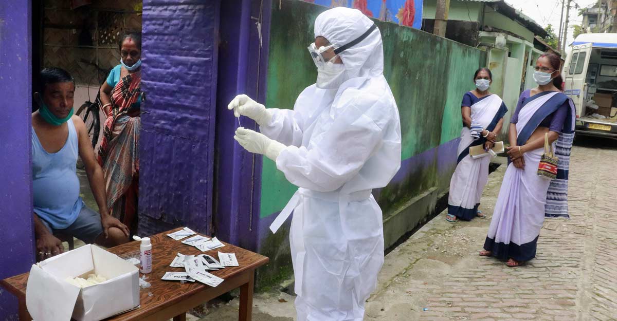 India's total cases cross 17 lakh, toll at 37,364 A health worker conducts door-to-door COVID-19 Rapid Antigen testing at a containment area of Garwanpatty, in Tezpur. Photo: PTI