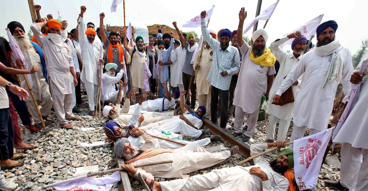 Farmers block roads, railways as protests mount over farm bills Farmers block roads, railways as protests mount over farm bills