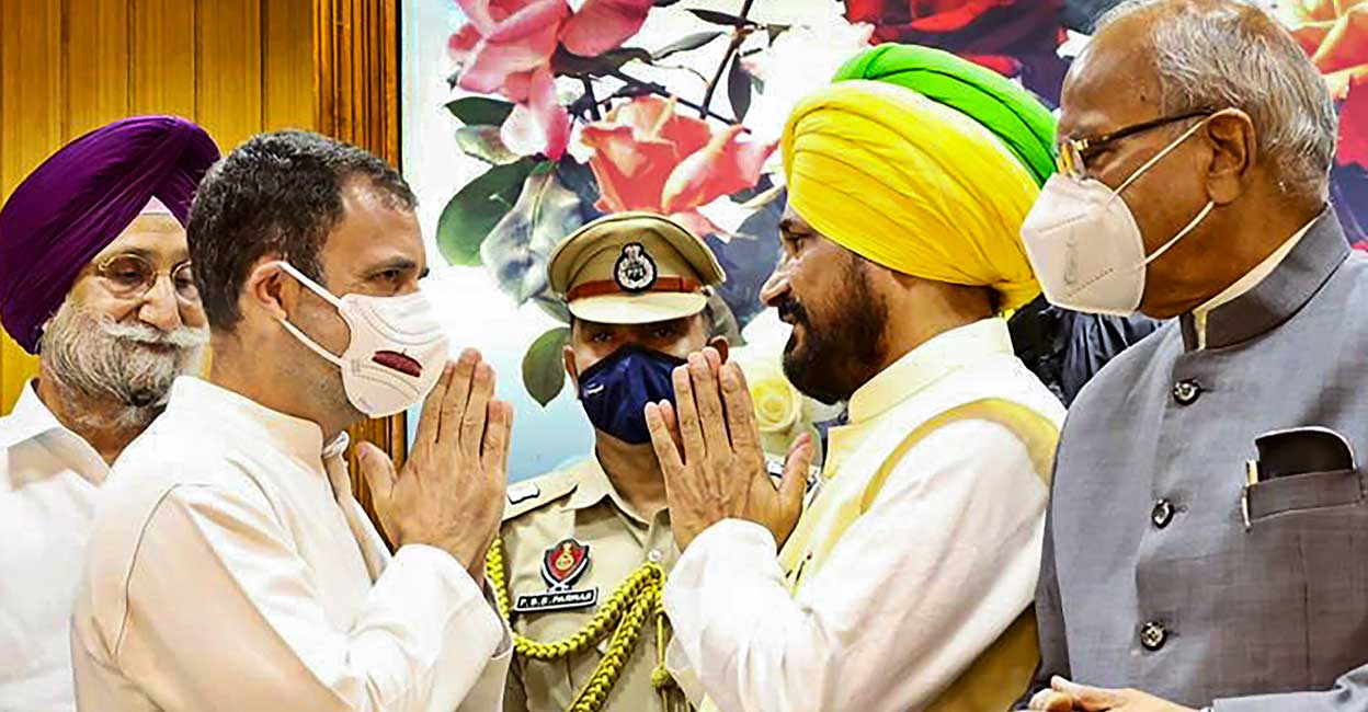 Congress MP Rahul Gandhi (left) greets new Punjab Chief Minister Charanjit Singh Channi (centre) after the latter takes the oath of office during a ceremony, at Raj Bhawan in Chandigarh on Monday. Punjab Governor Banwarilal Purohit (right) is also seen. PTI