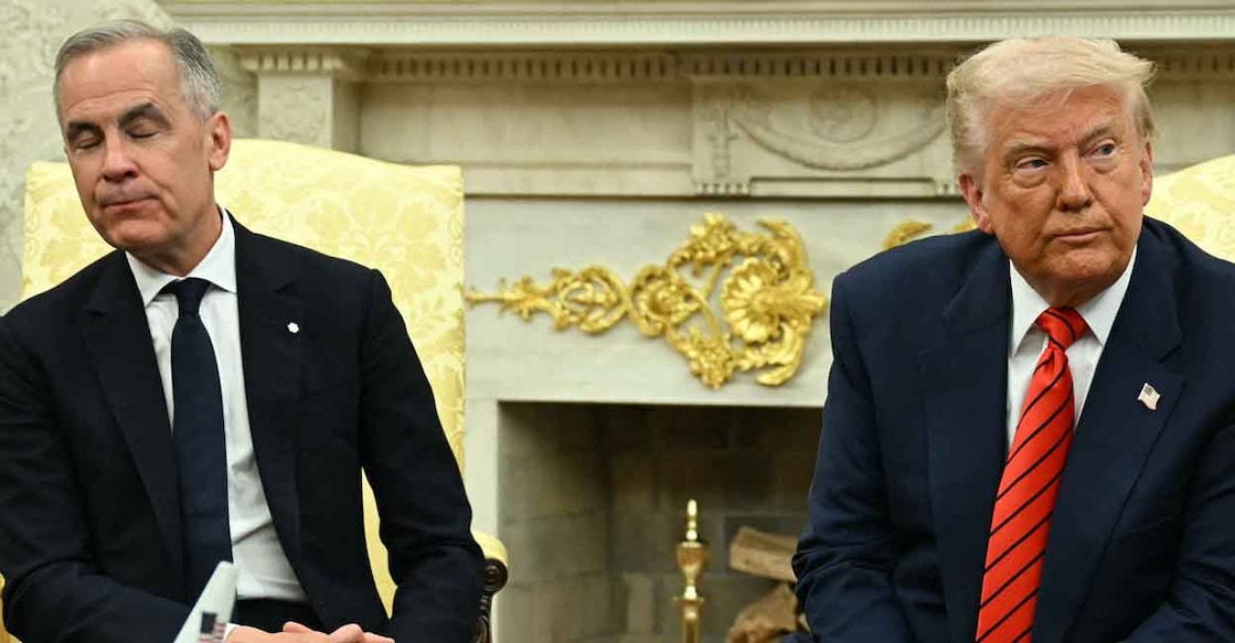 US-CANADA-POLITICS-DIPLOMACY-TRUMP-CARNEY US President Donald Trump and Canadian Prime Minister Mark Carney look on as they meet in the Oval Office of the White House in Washington, DC, on May 6, 2025. (Photo by Jim WATSON / AFP)