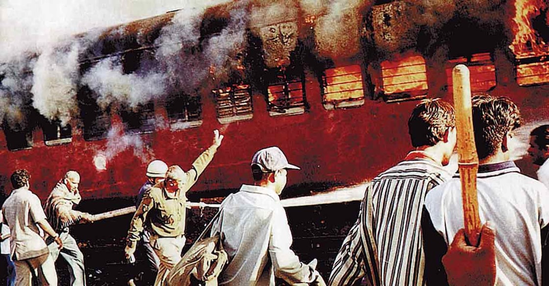 The S6 coach of Sabarmati Express Train burns near the Godhra Railway Station in Gujarat on February 27, 2002.