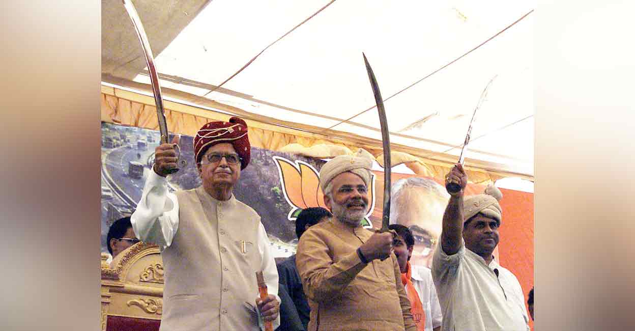 Modi with sword In this photograph from April 2004, Deputy Prime Minister LK Advani, Gujarat Chief Minister Narandra Modi and Rajendra Singh Rana pose with swords during the second leg of Bharat Uday Yatra at Viramgam, Ahmedabad. Photo: PTI