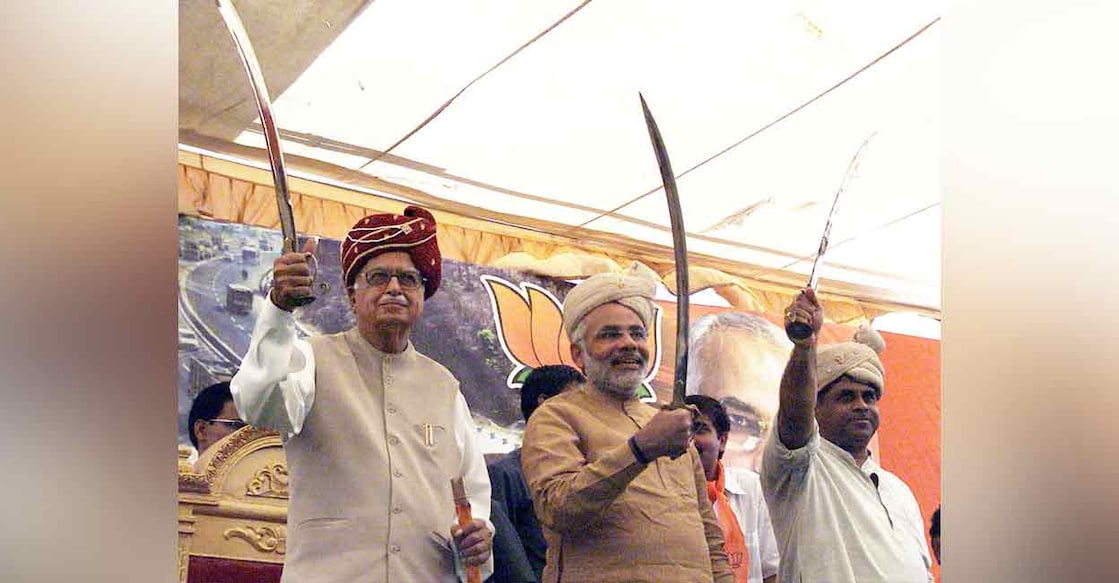 In this photograph from April 2004, Deputy Prime Minister LK Advani, Gujarat Chief Minister Narandra Modi and Rajendra Singh Rana pose with swords during the second leg of Bharat Uday Yatra at Viramgam, Ahmedabad. Photo: PTI
