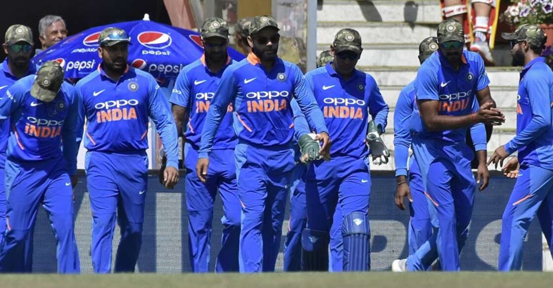 Pakistan wants ICC to rap India as players wear army caps on field