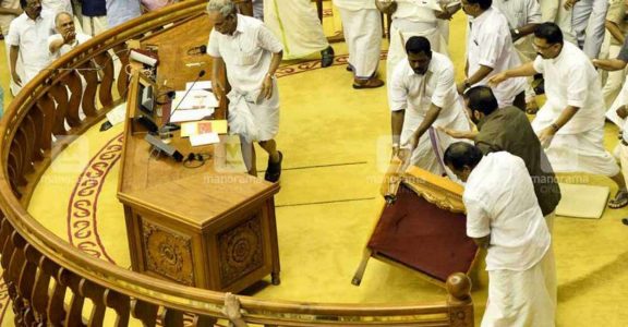 LDF legislators flinging the Speaker's chair from the podium LDF legislators flinging the Speaker's chair from the podium