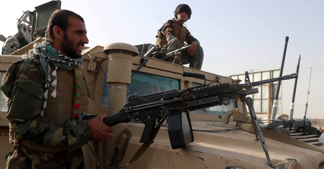 Afghan National Army soldiers keep watch at a checkpoint in the Guzara district of Herat province, Afghanistan July 9, 2021. REUTERS/Jalil Ahmad/File Photo