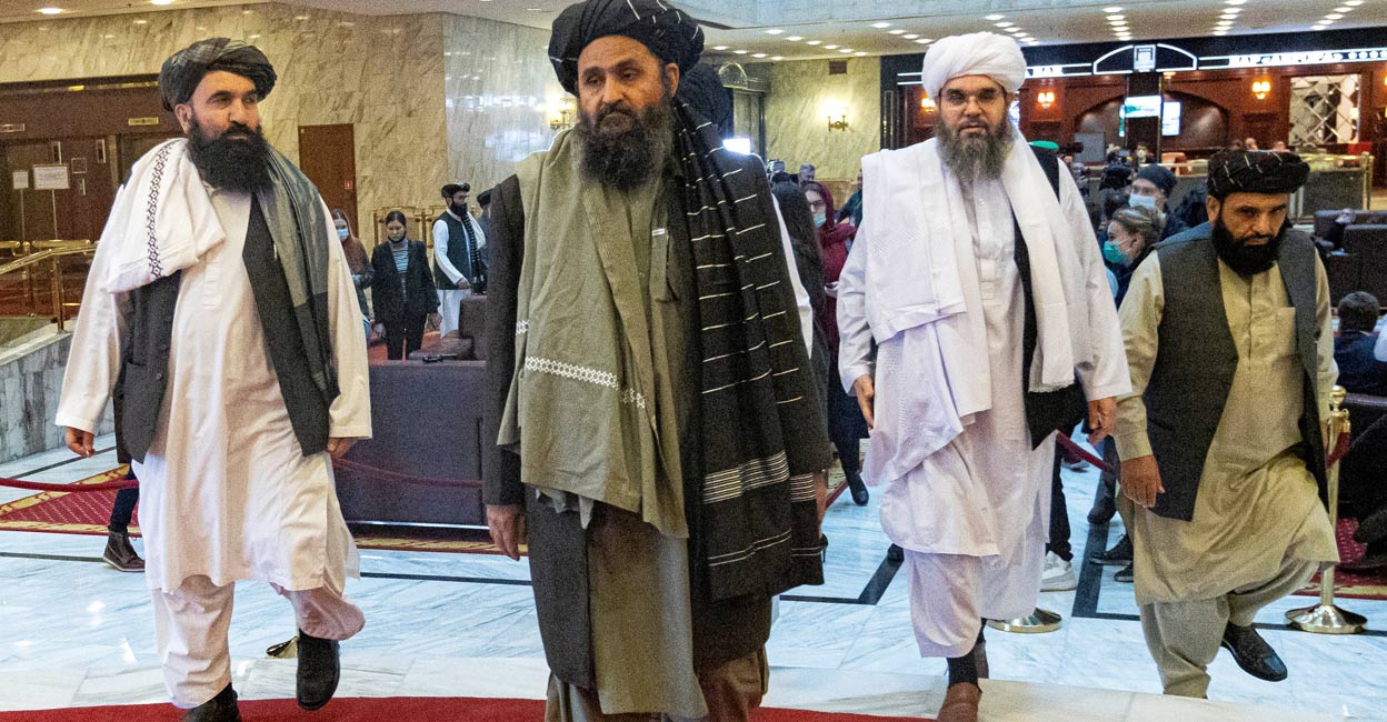 Mullah Abdul Ghani Baradar, the Taliban's deputy leader and negotiator, and other delegation members attend the Afghan peace conference in Moscow, Russia March 18, 2021. Alexander Zemlianichenko/Pool via Reuters
