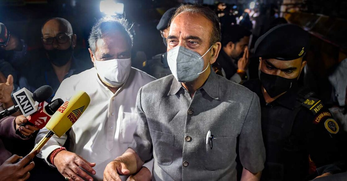 Senior Congress leaders Ghulam Nabi Azad and Anand Sharma interacts with media as he leaves after the end of the Congress Working Committee meeting over party's debacle in recent Assembly elections of five states, at AICC headquarters, in New Delhi, Sunday, March 13, 2022. Photo: PTI