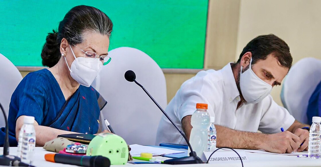 Sonia Gandhi and Rahul Gandhi Congress interim President Sonia Gandhi and party leader Rahul Gandhi during the Congress Working Committee meeting after party's debacle in recent Assembly elections of five states at AICC headquarters in New Delhi, March 13, 2022. Photo: PTI