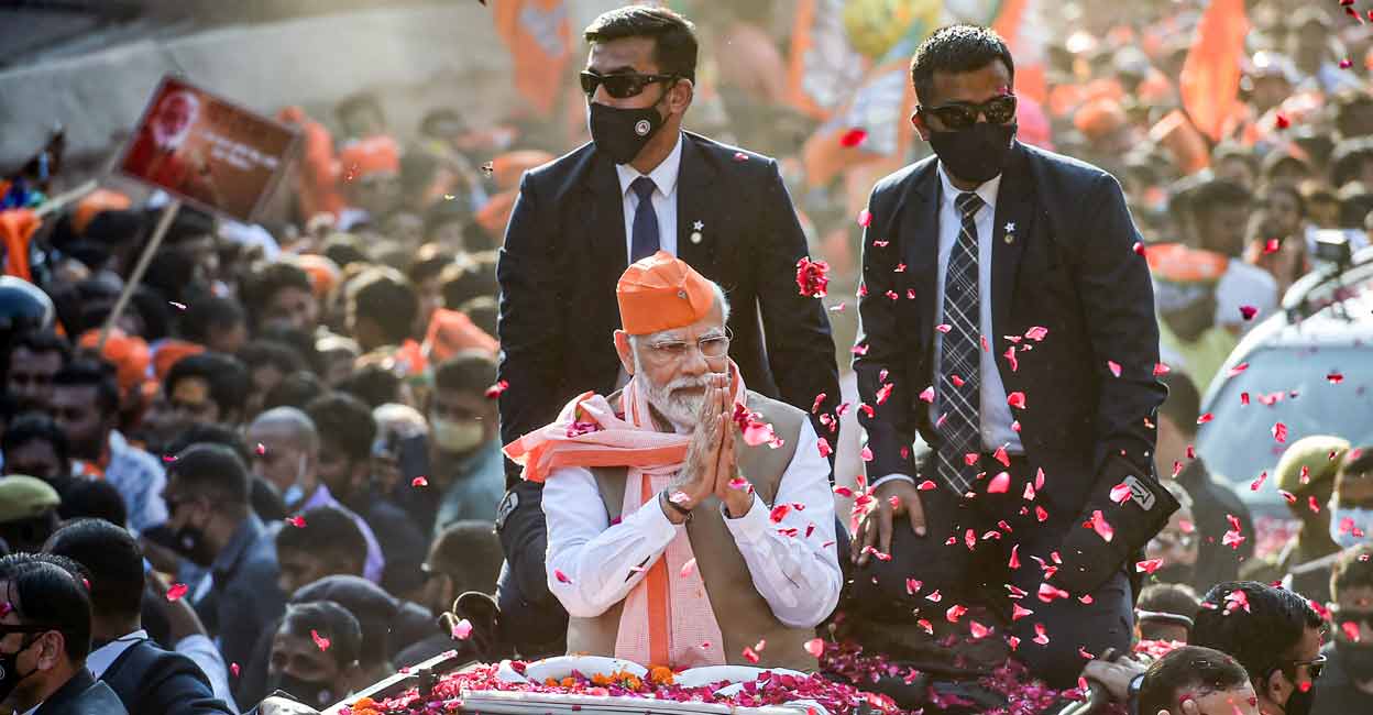 PTI03_04_2022_000179B Prime Minister Narendra Modi during a roadshow for UP polls, in Varanasi district. Photo: PTI