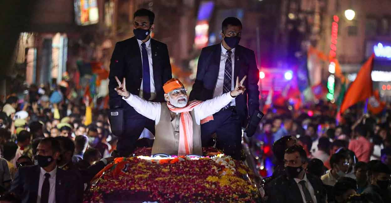 PTI03_04_2022_000305B Prime Minister Narendra Modi during a roadshow for UP polls, in Varanasi district. Photo: PTI