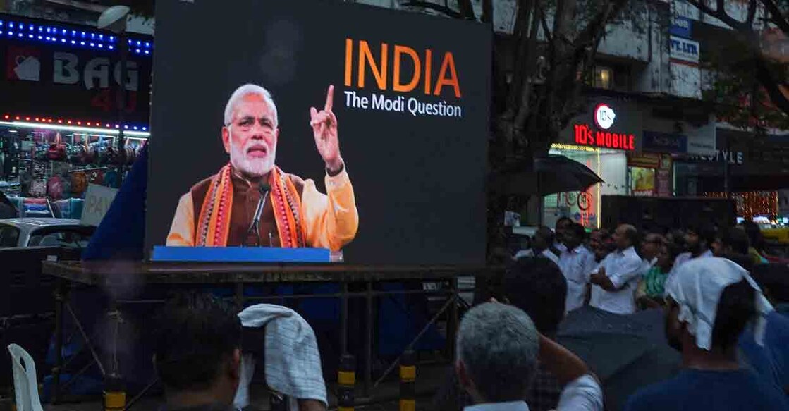 People watch the BBC documentary "India: The Modi Question", on a screen installed at the Marine Drive junction under the direction of the district Congress committee, in Kochi on January 24, 2023. File Photo: Arun CHANDRABOSE / AFP