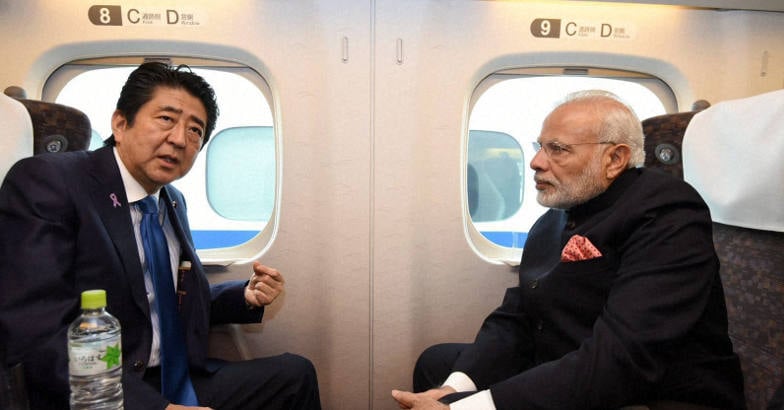 modi-abe-shinkansen Prime Minister Narendra Modi and his Japanese counterpart Shinzo Abe on-board the Shinkansen bullet train to Kobe in Japan on Saturday. PTI Photo/PIB