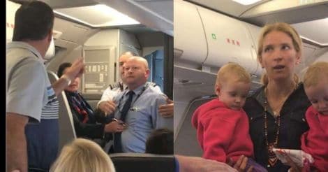 American Airlines' staff whacks woman with stroller, just missing her baby | Video