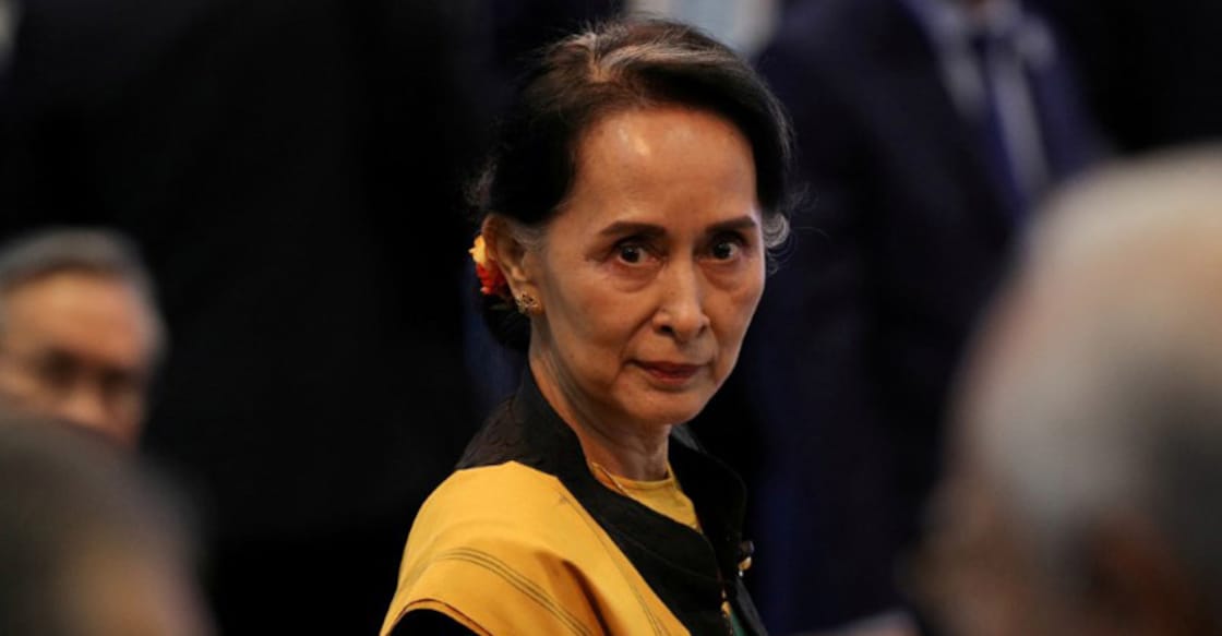 Suu Kyi defends court decision to jail journalists