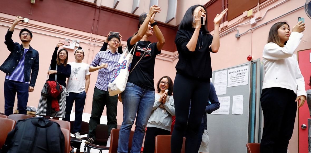 Landslide democratic win in Hong Kong election raises pressure on city's leader Landslide democratic win in Hong Kong election raises pressure on city's leader