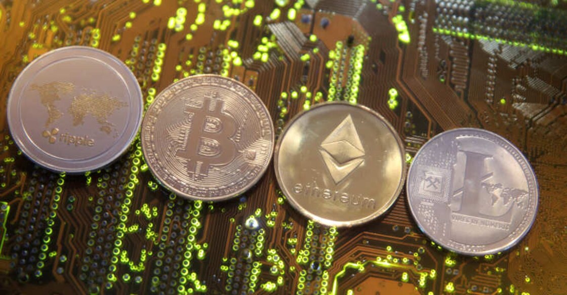 Representations of the Ripple, Bitcoin, Etherum and Litecoin virtual currencies are seen on a PC motherboard in this illustration picture, February 13, 2018. Reuters
