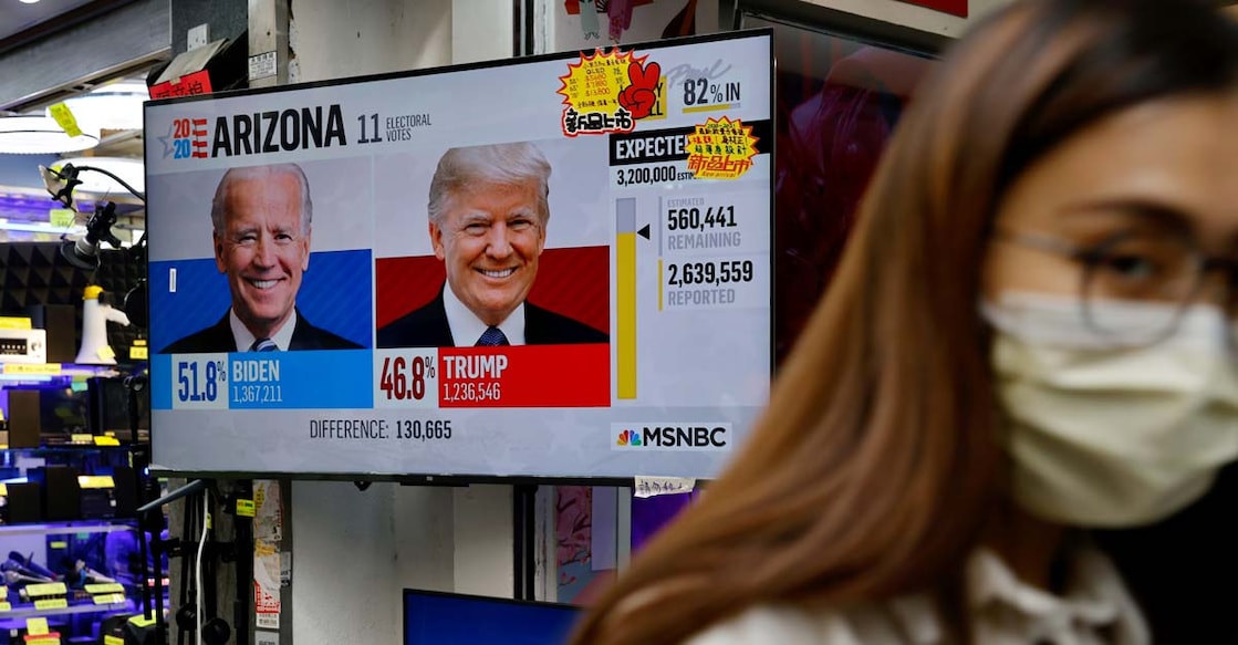 With votes still to be counted, Trump falsely claims victory; rival Biden confident