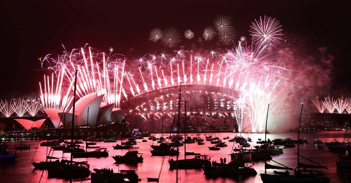 Fireworks explode over empty streets as 2020 slinks away into history