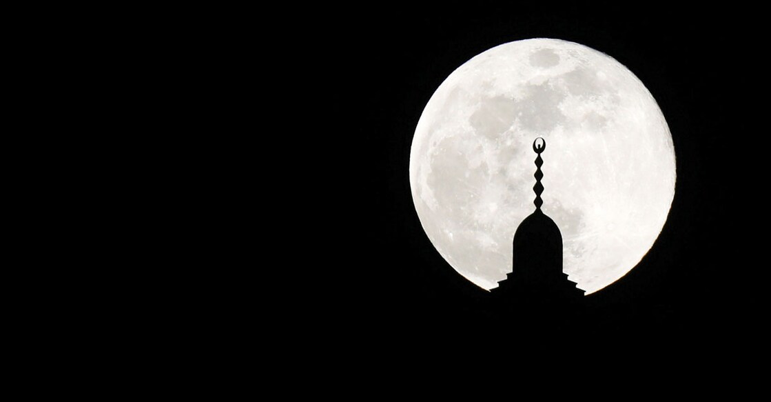 'Full-flower supermoon' rises on world starting to emerge from pandemic