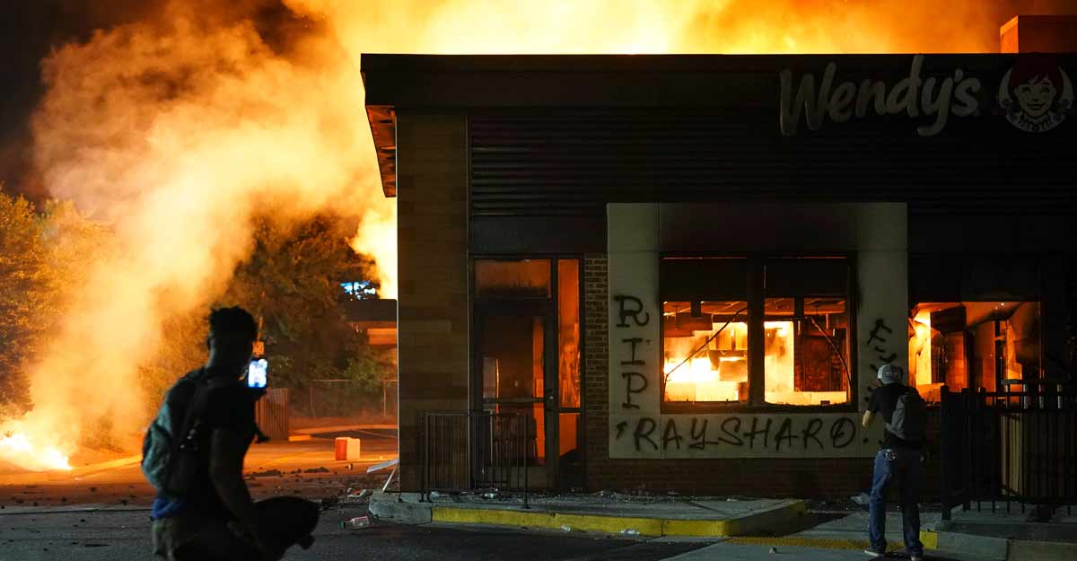 Protesters burn down Wendy's in Atlanta where black man was shot dead by police Protesters burn down Wendy's in Atlanta where black man was shot dead by police