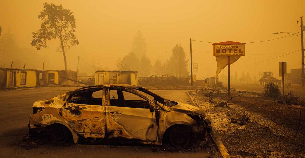 Scores of wildfires scorch US West Coast, killing at least nine