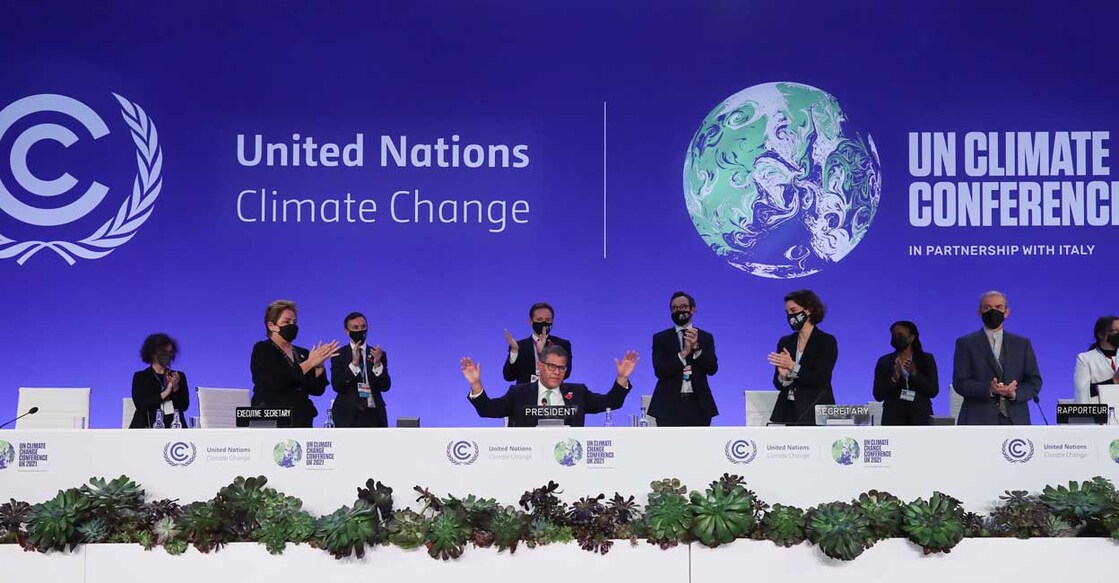 COP26 President Alok Sharma gestures as he receives applause during the UN Climate Change Conference (COP26) in Glasgow, Scotland, November 13, 2021. Reuters/Yves Herman