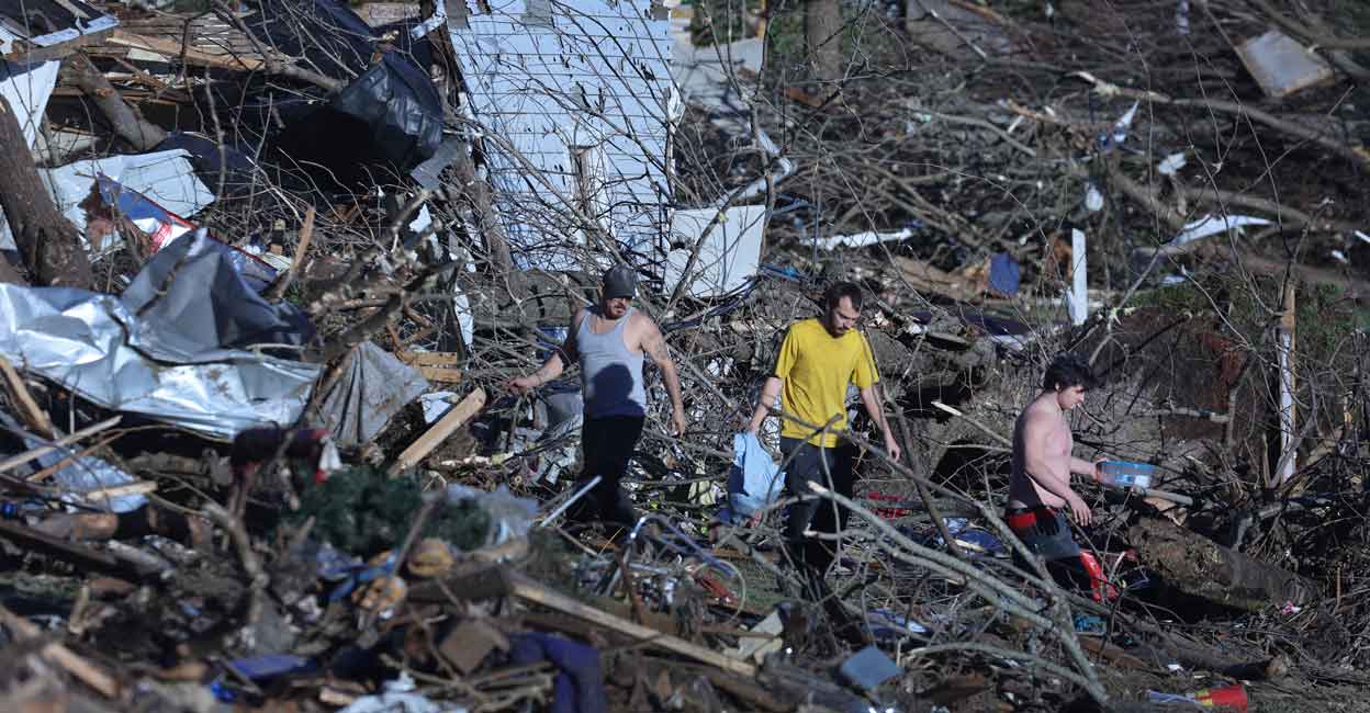 Residents continue to salvage belongings from destroyed homes after a tornado tore through a large section of the city late Friday evening on December 12, 2021 in Mayfield, Kentucky. Photo: Scott Olson/Getty Images/AFP