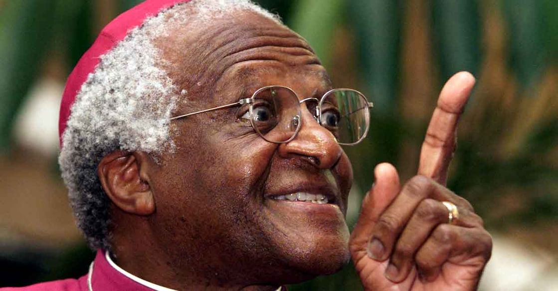 Archbishop Desmond Tutu makes a point as he addresses a meeting March 16, 2001 to raise awareness for World Tuberculosis Day. Photo: Reuters/Mike Hutchings