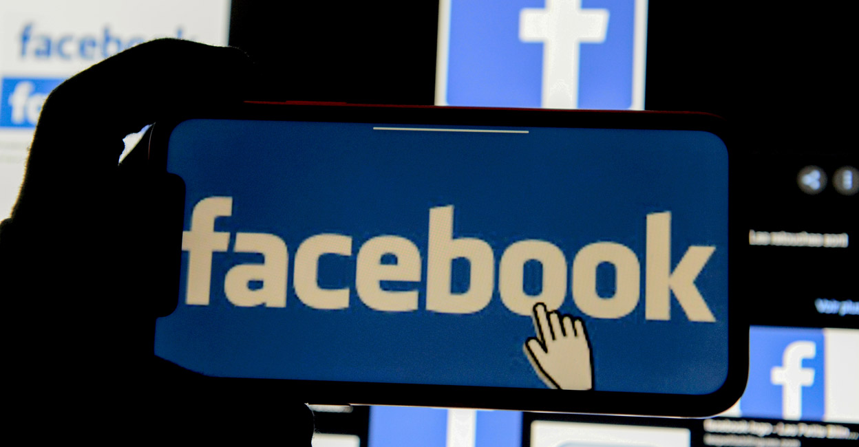 The Facebook logo is displayed on a mobile phone in this picture illustration taken December 2, 2019. File Photo: REUTERS/Johanna Geron/Illustration