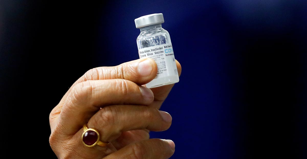 Indian Health Minister Harsh Vardhan holds a dose of Bharat Biotech's COVID-19 vaccine called COVAXIN, during a vaccination campaign at All India Institute of Medical Sciences (AIIMS) hospital in New Delhi, India, January 16, 2021. REUTERS/Adnan Abidi/Files