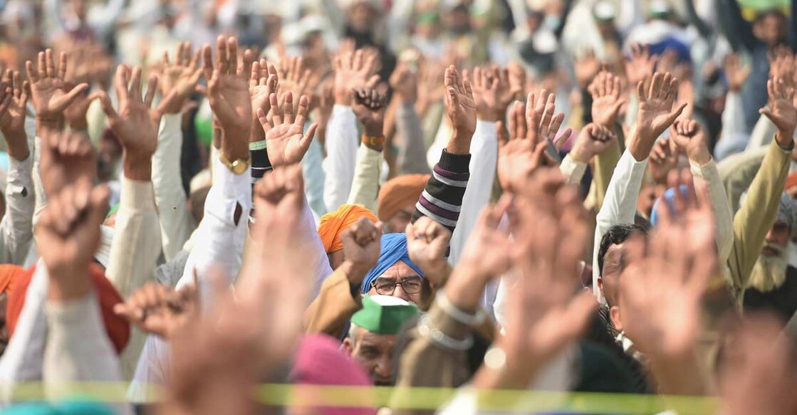 Farmers during their ongoing protest against the new farm laws, at Ghazipur border in New Delhi, Tuesday. Photo: PTI/Vijay Verma