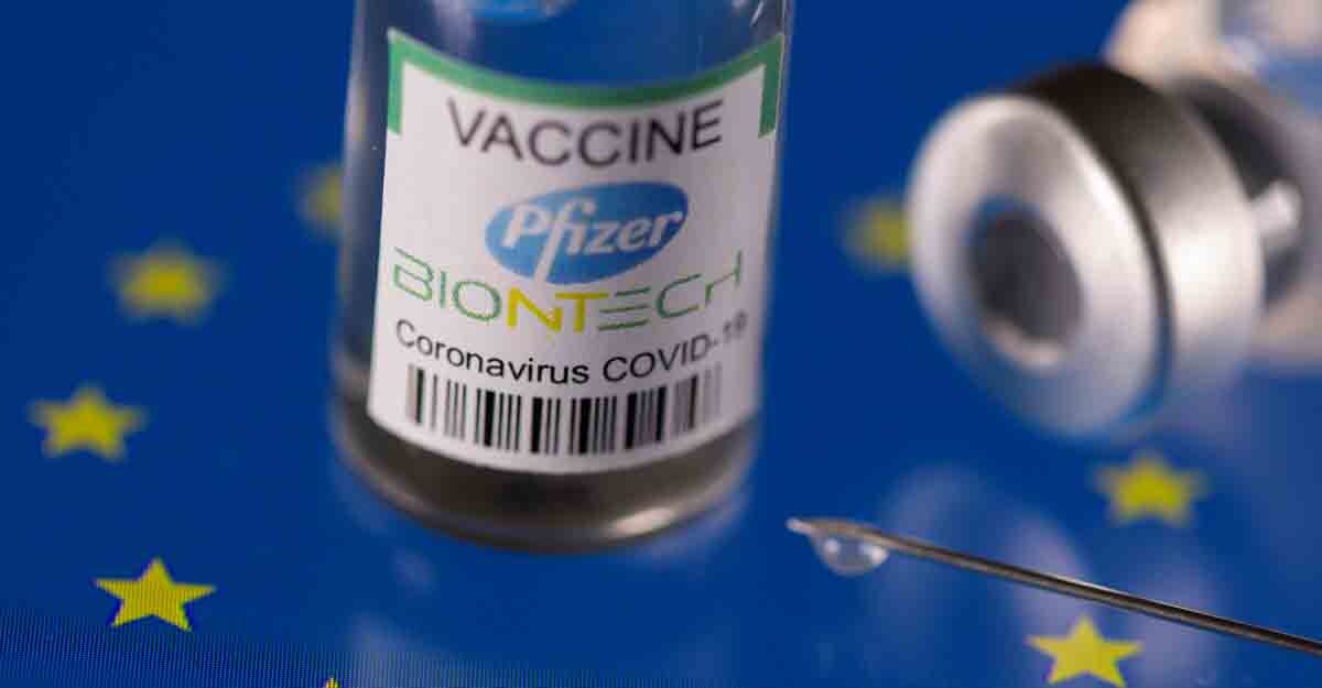 Vials labelled "Pfizer BioNtech coronavirus disease (COVID-19) vaccine" placed on displayed EU flag are seen in this illustration picture taken March 24, 2021. REUTERS/Dado Ruvic/Illustration