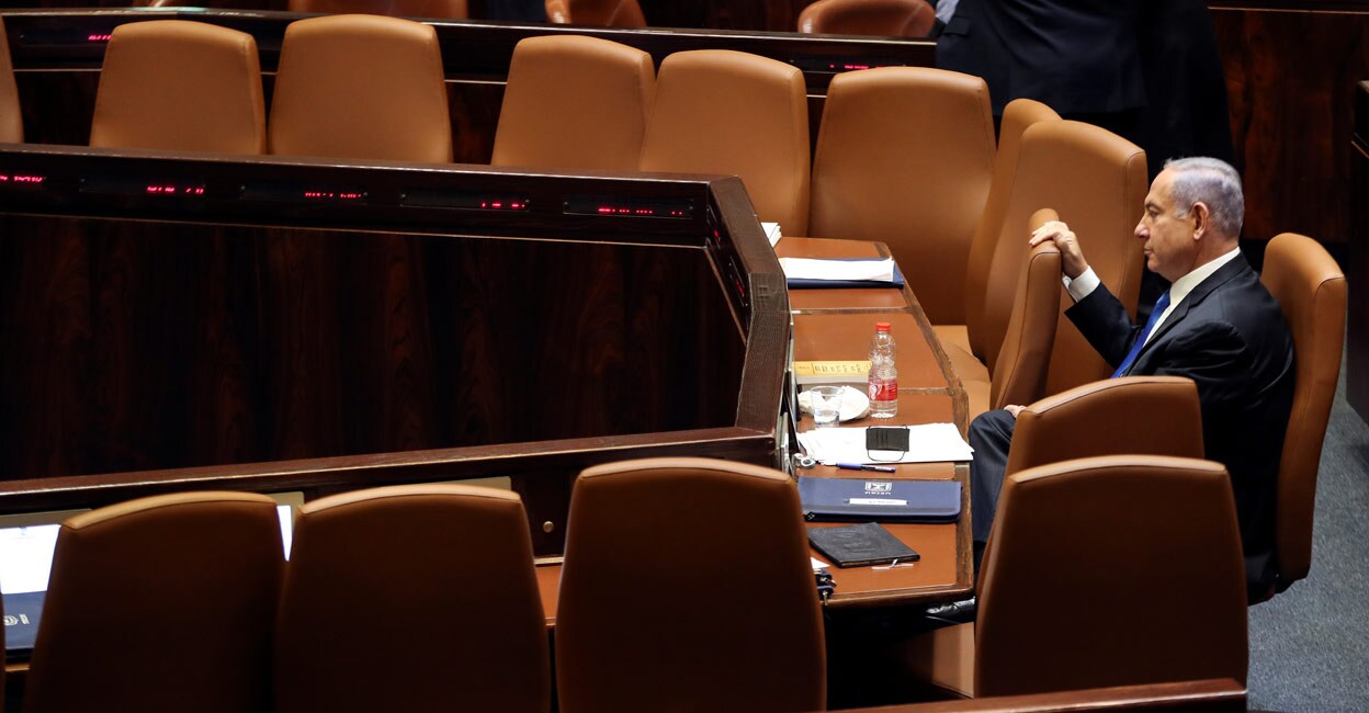 Netanyahu out, Bennett in as Israel marks end of an era Israeli Prime Minister Benjamin Netanyahu looks on during a special session of the Knesset, Israel's parliament, to approve and swear-in a new coalition government, in Jerusalem June 13, 2021. Photo: REUTERS/Ronen Zvulun