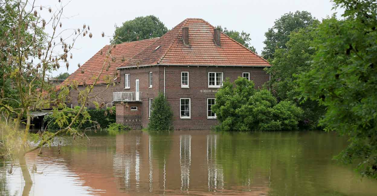 Europe flood High water is seen near a house, in Roermond, Netherlands, July 16, 2021. Photo: REUTERS/Eva Plevier