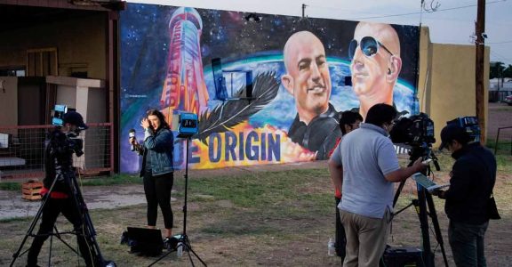 Jeff Bezos makes 11-minute space journey on his company's first passenger flight Jeff Bezos makes 11-minute space journey on his company's first passenger flight
