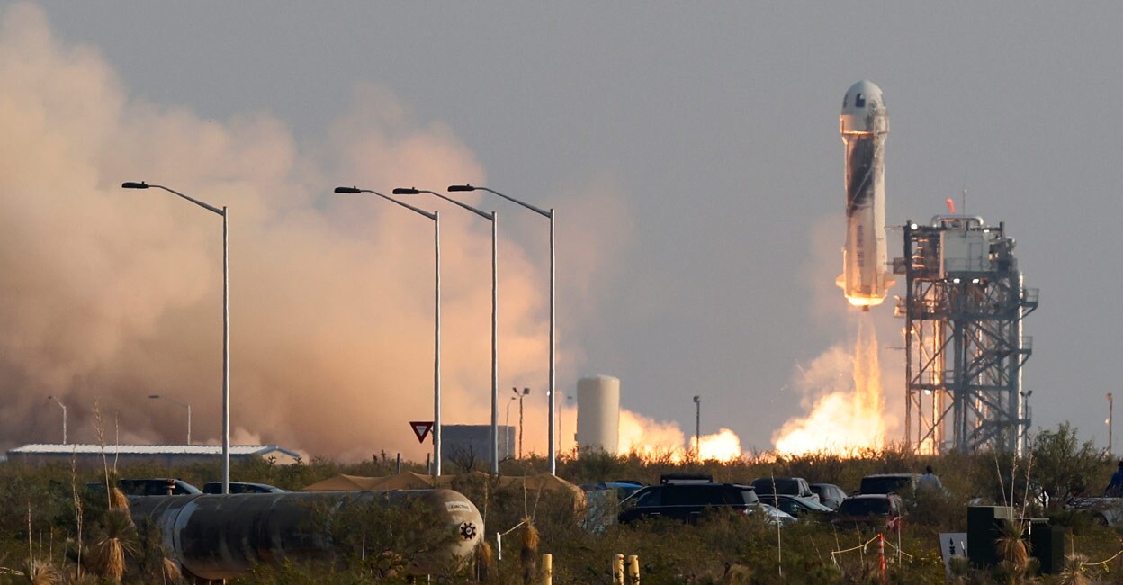 Jeff Bezos, world's richest man, blasts off to space on his company's first passenger flight