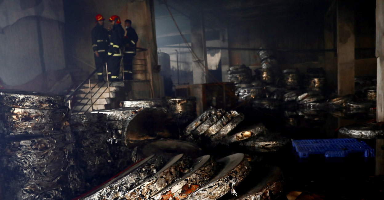 Firefighters inside burnt Dhaka food factory Firefighters inside burnt Dhaka food factory