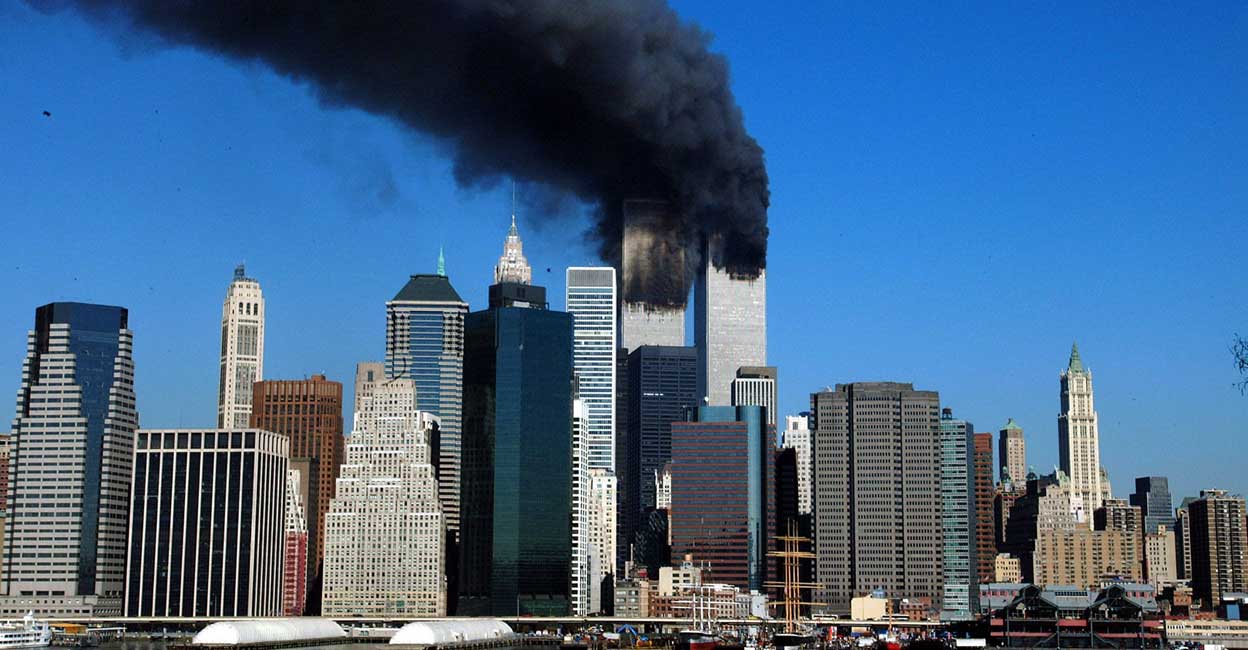 The Twin Towers of the World Trade Center in New York billowing smoke after hijacked airliners crashed into them. The Twin Towers of the World Trade Center in New York billowing smoke after hijacked airliners crashed into them. AFP PHOTO / HENNY RAY ABRAMS