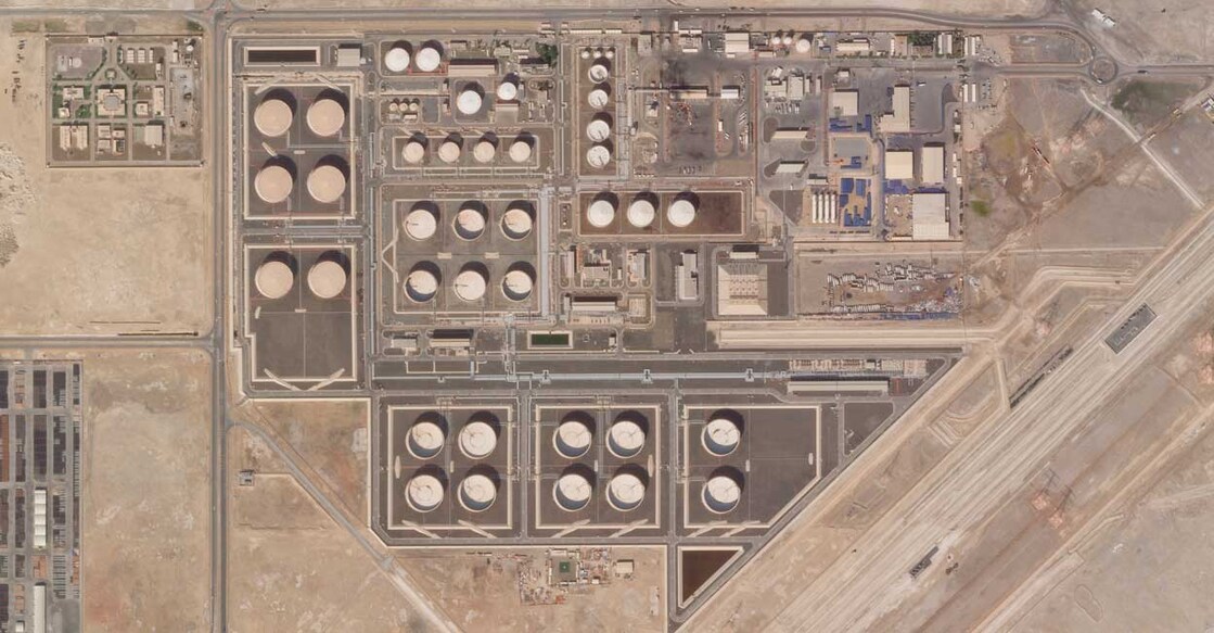 This satellite image provided by Planet Labs PBC shows the aftermath of an attack claimed by Yemen's Houthi rebels on an Abu Dhabi National Oil Co. fuel depot in the Mussafah neighborhood of Abu Dhabi, United Arab Emirates, Saturday, Jan. 22, 2022. (Planet Labs PBC via AP)