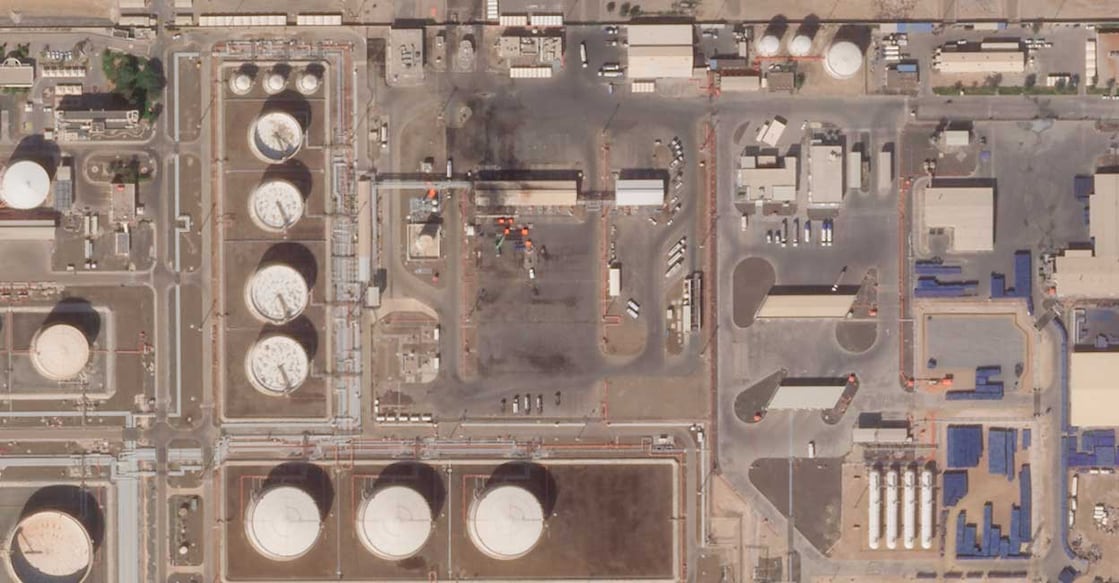 This satellite image provided by Planet Labs PBC shows the aftermath of an attack claimed by Yemen's Houthi rebels on an Abu Dhabi National Oil Co. fuel depot in the Mussafah neighborhood of Abu Dhabi, United Arab Emirates, Saturday, Jan. 22, 2022. (Planet Labs PBC via AP)