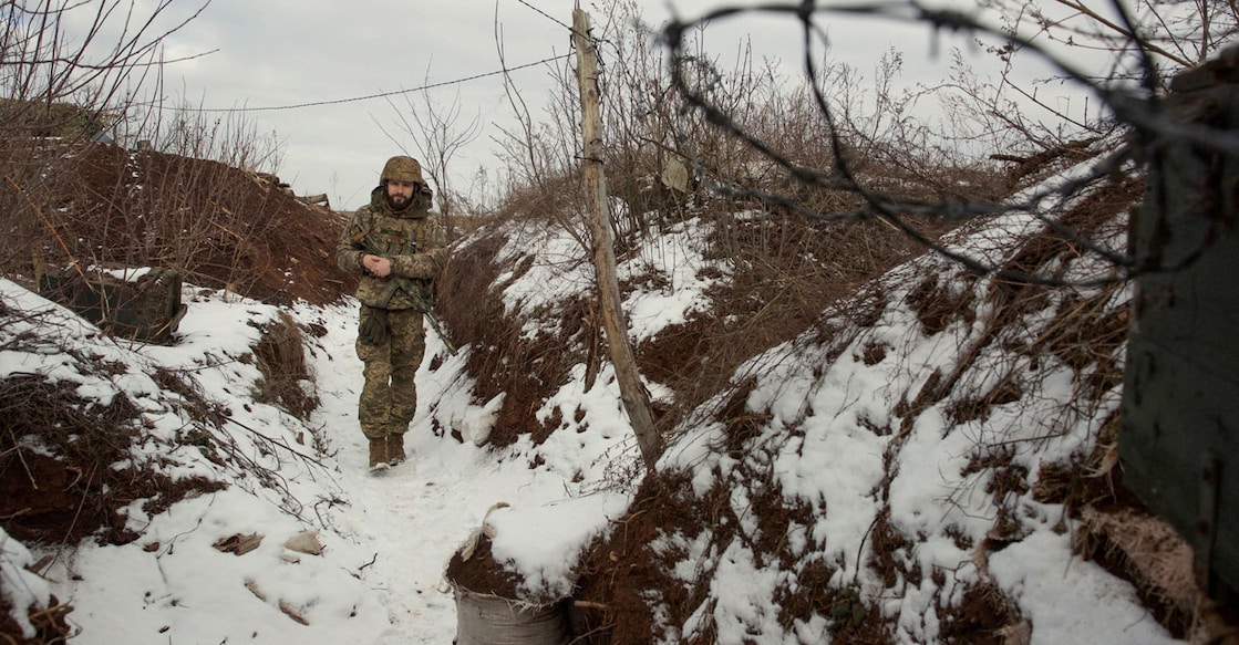 A service member of the Ukrainian armed forces walks at combat positions near the line of separation from Russian-backed rebels near Horlivka in the Donetsk region, Ukraine, January 22, 2022. Photo: Reuters/Anna Kudriavtseva/File Photo